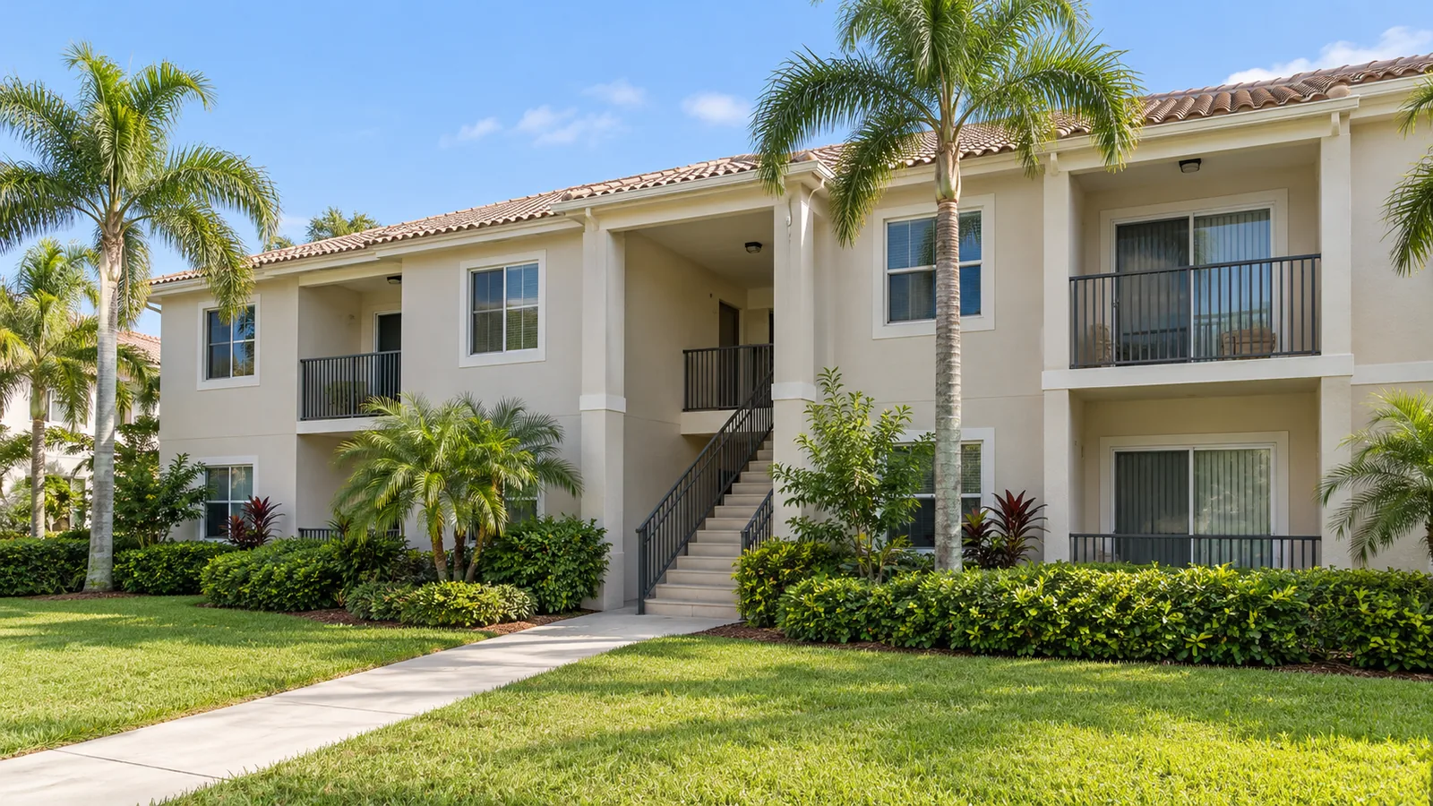 Illustrative low-rise managed residential building and common walkway.